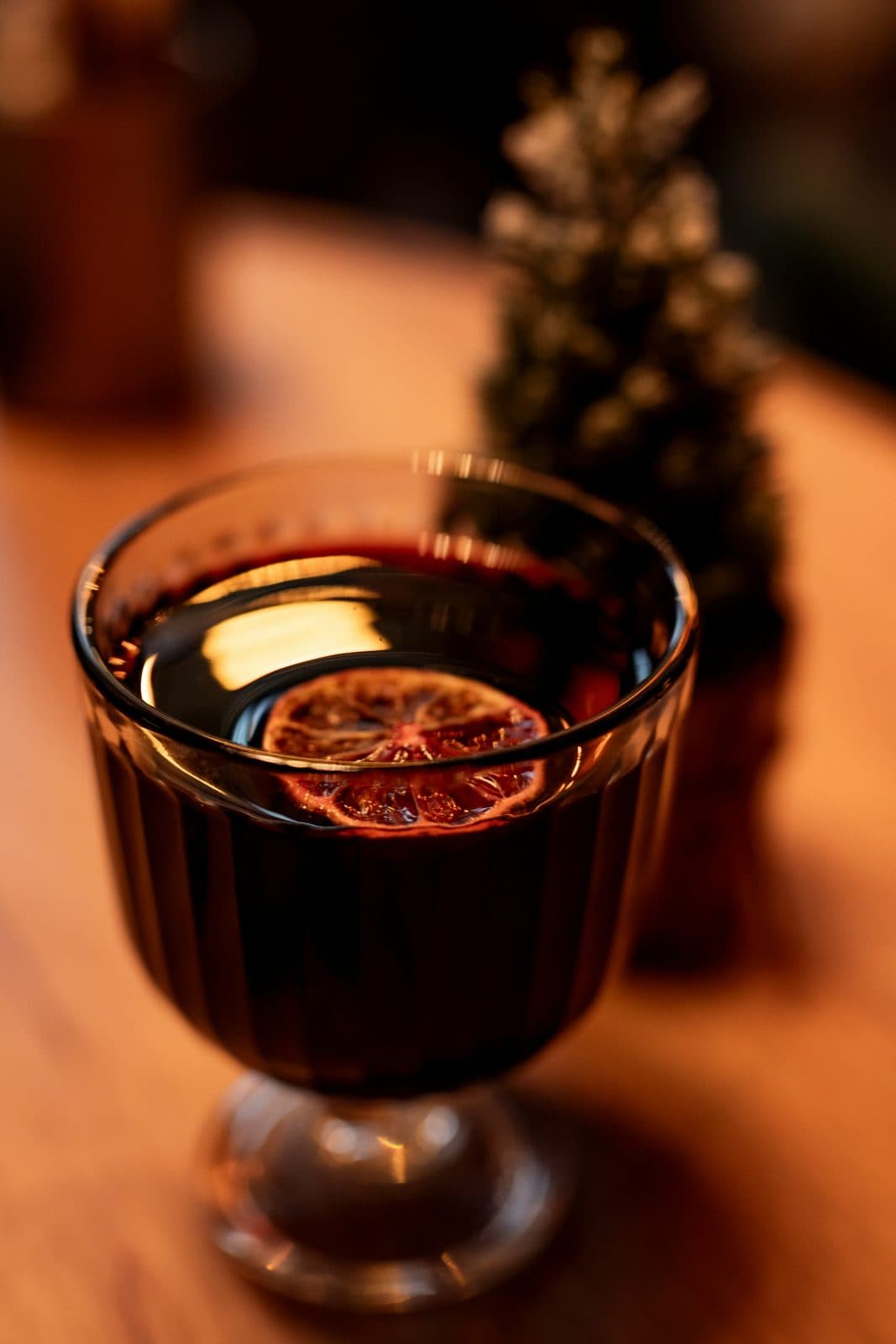 Non-alcoholic mulled wine with a dried orange slice in a glass